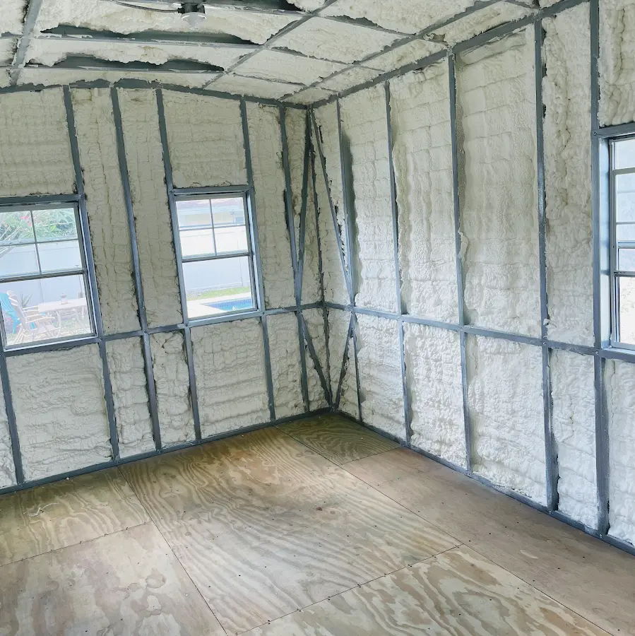 Closed-cell spray foam insulation applied to wall cavities in a residential project in Walker